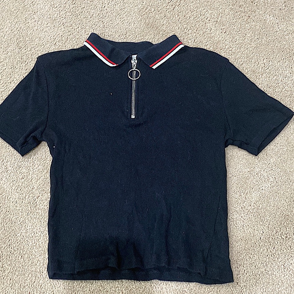 This is a crop top that has a circle zipper and is very fitting